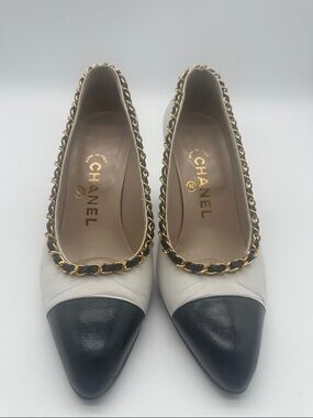 CHANEL Two-Tone Leather Pointed Toe Flats in White and Black